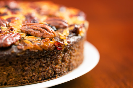 Pecan cake made with sliced almonds and dried cranberriesの写真素材