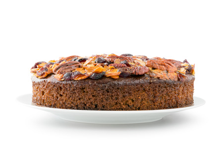 Pecan cake made with sliced almonds and dried cranberries isolated on whiteの写真素材