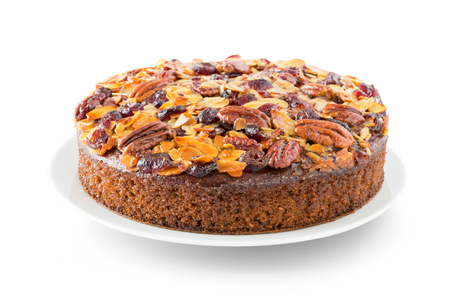 Pecan cake made with sliced almonds and dried cranberries isolated on whiteの写真素材