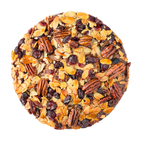 Pecan cake made with sliced almonds and dried cranberries isolated on whiteの写真素材