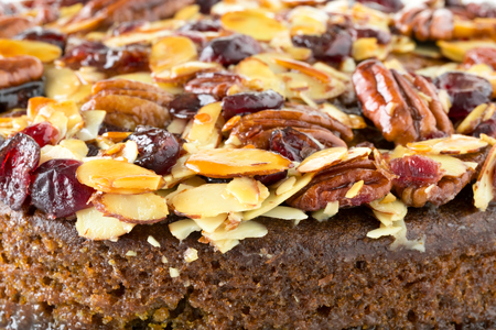 Pecan cake made with sliced almonds and dried cranberriesの写真素材