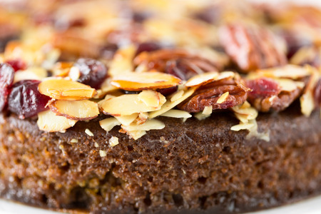Pecan cake made with sliced almonds and dried cranberriesの写真素材
