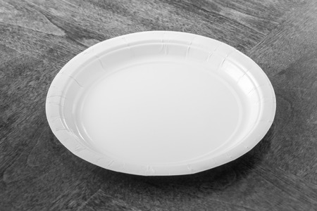 Paper plate on wooden tableの写真素材