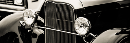 Classic car with close-up on headlightsの写真素材