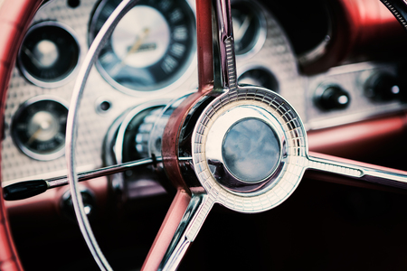 Classic car with close-up on steering wheel