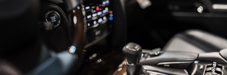 Car dashboard with focus on engine start stop buttonの写真素材