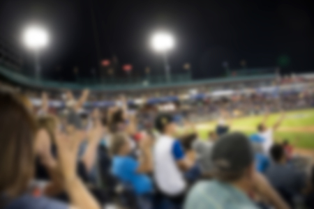Fans watching soccer game, soccer football fieldの写真素材
