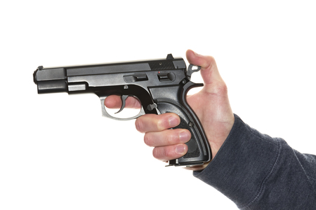 Man's hand holding gun isolated on white backgroundの写真素材