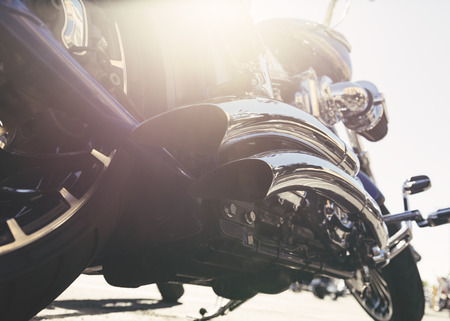 Motorcycle with chrome ports low angle photograph with close-up on exhaustの写真素材