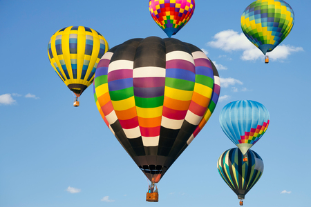 Hot air balloons up in the blue skyの写真素材