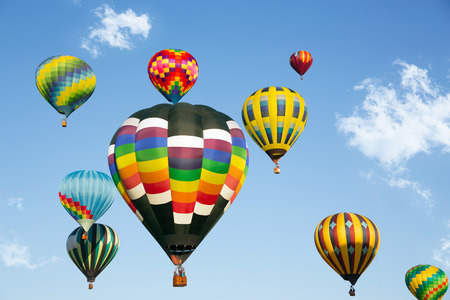 Hot air balloons up in the blue skyの写真素材