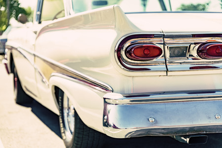 Photograph of a classic vehicle with close-up on tail lightsの写真素材