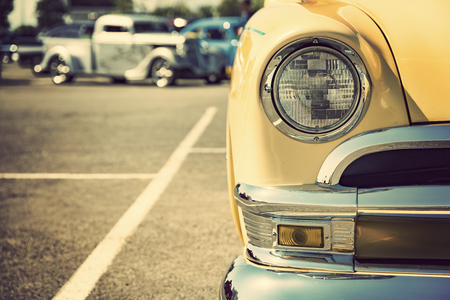 Photograph of a classic vehicle with close-up on headlightsの写真素材