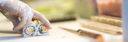 Sushi preparation in japanese restaurantの写真素材