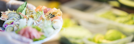Plate full of sushi rolls made in japanese restaurantの写真素材