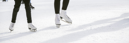 People ice skating on ice rinkの写真素材