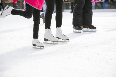 People ice skating on ice rinkの写真素材