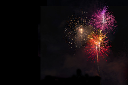 Fireworks display over dark skyの写真素材