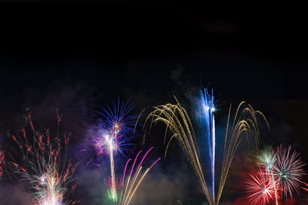 Fireworks display over dark skyの写真素材