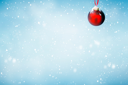 Christmas  with red ornament and falling snowの写真素材