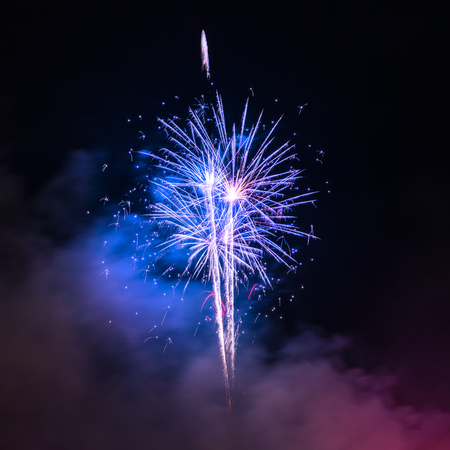 Fireworks display over dark skyの写真素材