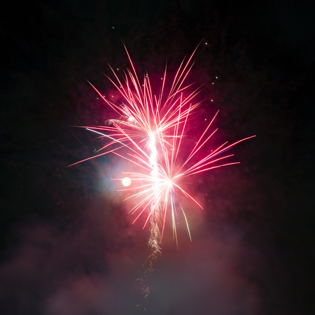 Fireworks display over dark skyの写真素材