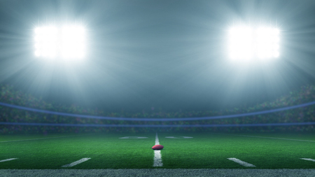 America football stadium brightly illuminatedの写真素材