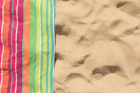 Beach towel on sandy tropical beachの写真素材