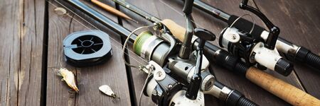 Fishing rods and accessories on woodenの写真素材