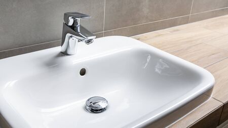 sink and faucet in bathroomの写真素材