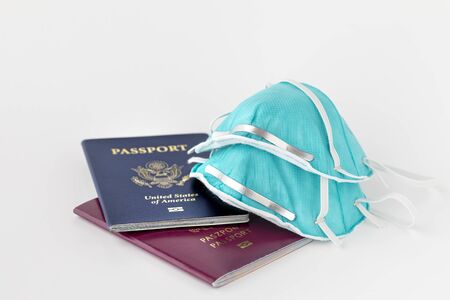 passports and flu, virus masks to protect against coronavirus, global epidemic conceptの写真素材