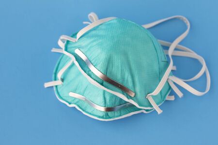 medical masks to protect against flu, virus on blue background, coronavirus conceptの写真素材