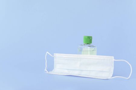 medical mask to protect against covid-19 flu with gel hand sanitizer, coronavirus conceptの写真素材