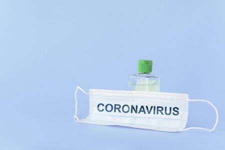 medical mask to protect against covid-19 flu with gel hand sanitizer, coronavirus conceptの写真素材