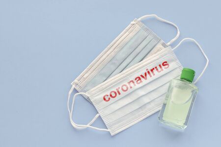 medical mask to protect against covid-19 flu with gel hand sanitizer, coronavirus conceptの写真素材