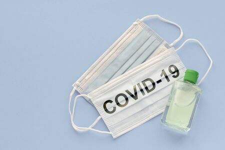 medical mask to protect against covid-19 flu with gel hand sanitizer, coronavirus conceptの写真素材