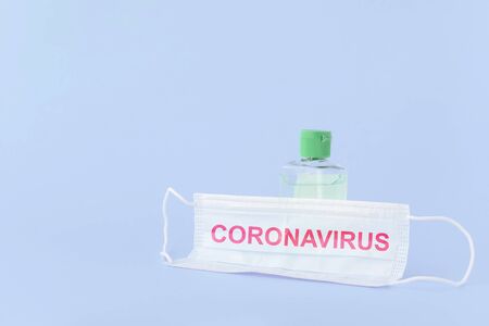medical mask to protect against covid-19 flu with gel hand sanitizer, coronavirus conceptの写真素材