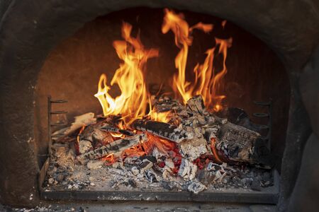 Wood burning in empty barbecue grillの写真素材