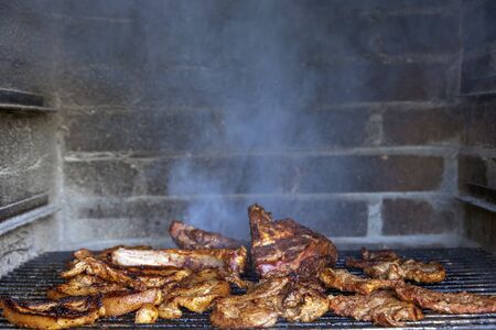 Meat on the barbecue grill, beef steakの写真素材