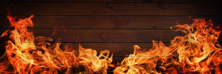 Fire flames on wooden background, barbecue grill copy spaceの写真素材