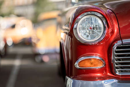 Classic car show, close-up on vehicle headlights, vintage colorの写真素材