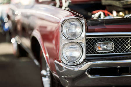 Classic car show, close-up on vehicle headlights, vintage colorの写真素材
