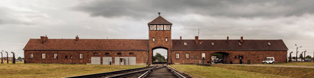 Railroad track to main gate of Auschwitz former German concentration and extermination camp in Polandのeditorial素材