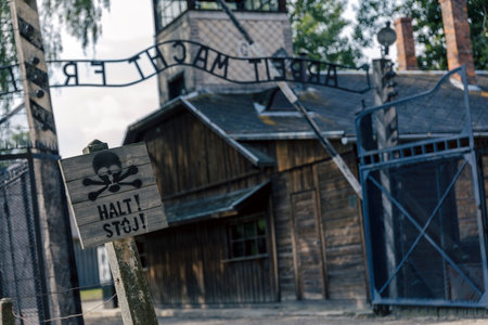 Entrance gate to former German Nazi concentration and extermination camp in Auschwitz Polandのeditorial素材
