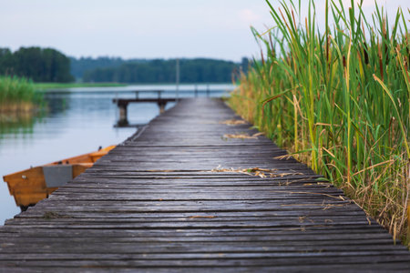 Wooden pier on a lake in the morning. Landscape.の写真素材