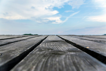 Wooden pier with sky background, Long exposure photo with selective focusの写真素材