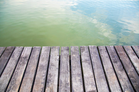 Wooden pier on the lake in the summer. Abstract background.の写真素材