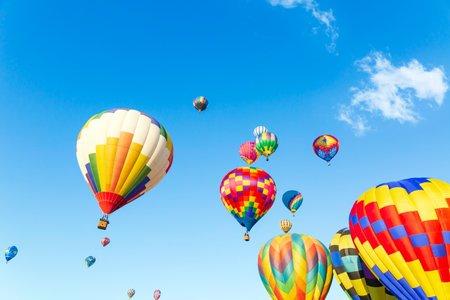Hot air balloons flying in the blue sky at Albuquerque, New Mexicoの写真素材