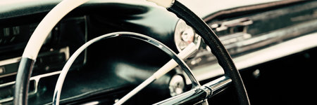 Detail of a classic american car with steering wheel and dashboardの写真素材