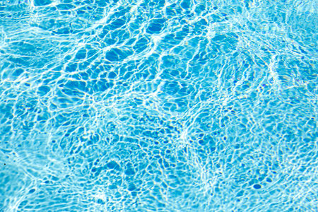 Blue water in swimming pool rippled background, Swimming pool backgroundの写真素材